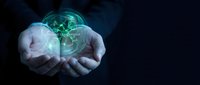 Businessman hands holding glowing green digital globe with network connections representing global technology and connectivity solutions for modern business.