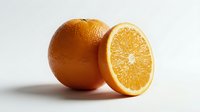 Fresh ripe orange with a sliced half showing juicy pulp, isolated on white background, perfect for food, nutrition, and healthy lifestyle projects.