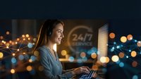 Young professional woman working late at laptop with warm bokeh lights creating cozy atmosphere for remote work, freelancing, and digital productivity.