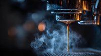 Aromatic espresso extraction with rising steam from professional coffee machine portafilter in dark atmospheric cafe setting.