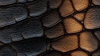 Dramatic contrast of dark and golden brown leather texture with organic cell-like pattern creates abstract background for luxury design projects.