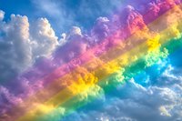 Vibrant rainbow colors streak across fluffy clouds in blue sky, creating a magical atmospheric phenomenon for nature and weather designs.