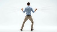 Businessman celebrating success with raised fists in victory pose, rear view of professional male in business casual attire expressing triumph and achievement.