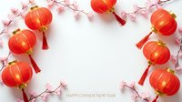 Red Chinese lanterns with pink cherry blossoms frame white background for lunar new year celebration and spring festival decorations.