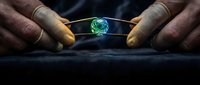 Two hands holding glowing green crystal sphere on dark surface, symbolizing energy, power, and environmental sustainability for business and technology concepts.