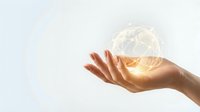 Hand holding glowing wireframe globe with golden light, representing global connectivity, technology innovation, and worldwide business networks for corporate communications.