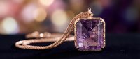 Elegant amethyst gemstone pendant on delicate gold chain against soft bokeh background, luxury jewelry design for fashion and accessory marketing.