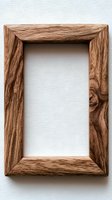 Rustic wooden picture frame with natural grain texture on white background, empty space for artwork or photos. Suitable for mockups and interior design.