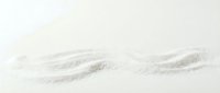 Fine white sand texture with gentle wave patterns across neutral background, suitable for spa, wellness, and minimalist design projects.