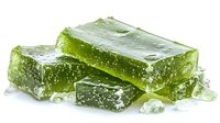 Fresh green aloe vera gel cubes with ice crystals on white background, natural organic skincare and wellness ingredient for cosmetic products.