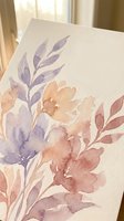 Watercolor floral painting with purple and peach flowers on textured paper, artistic botanical illustration for home decor and creative projects.
