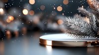Elegant winter holiday display with frosted evergreen branch and copper platform against warm bokeh lights and falling snow for seasonal product presentation.