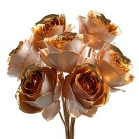 Luxurious golden metallic roses bouquet with shimmering copper finish isolated on white background for premium wedding decor and elegant floral arrangements.