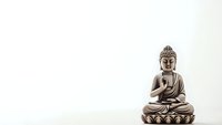Bronze Buddha statue in meditation pose on lotus base against clean white background for spiritual and wellness design projects.