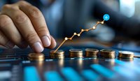Stacked gold coins with upward trending graph line showing financial growth and investment success. Male hand pointing at rising market data on blue background.