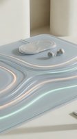 Wireless earbuds with charging case displayed on flowing liquid marble surface with soft pastel colors, suitable for tech product marketing and electronics advertising.