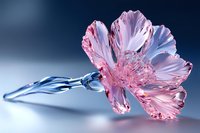 Delicate pink crystal flower with translucent petals and silver stem against blue background, showcasing intricate glass artistry and light reflection details.