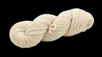 Twisted skein of natural cream wool yarn isolated on transparent background, ready for knitting craft designs, stickers, t-shirt prints, and print on demand use.
