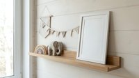 Minimalist nursery shelf with wooden toys, white frames and bunting banner creating cozy Scandinavian children's room decor for modern family homes.