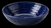 Deep blue ceramic bowl with glossy glaze and swirl texture, isolated on transparent background. Ready for T-shirt design, clipart, stickers, print on demand, and sublimation use.