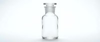 Clear glass reagent bottle with stopper on white background, isolated laboratory glassware for science, chemistry, and medical research use.