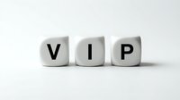 White cube blocks spelling VIP letters on clean background representing very important person status and exclusive membership privileges.