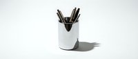 White ceramic pen holder with black markers and pens isolated on white background, ready for office design, stationery mockups, and organizational product presentations.