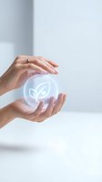 Female hands holding glowing leaf icon in sphere, representing eco-friendly sustainability, green energy, and environmental conservation for business and technology concepts.