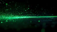 Glowing green particles and light trail effect against dark background create magical atmosphere with bokeh and sparkle elements for abstract design projects.