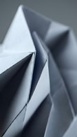 Abstract metallic drill bit macro with sharp spiral flutes and geometric shadows creating industrial precision tool background for manufacturing concepts.