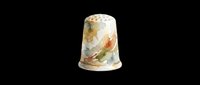 Porcelain thimble with delicate floral design isolated on transparent background, ready for clipart, print-on-demand products, stickers, and digital craft designs.