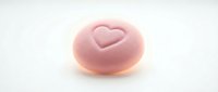 Pink frosted donut with heart symbol on white background, isolated bakery treat for food and dessert design projects.