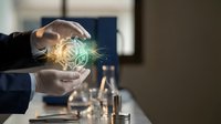 Professional businessman hands protecting glowing green dollar symbol representing financial security and wealth management in modern office setting.