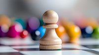 Wooden chess pawn piece on board with colorful blurred game pieces in background. Strategic thinking and planning concept for business presentations.