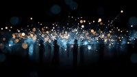 Silhouettes of people standing against magical glowing blue bokeh lights and sparkles creating ethereal atmosphere at night, mystical dreamy background.