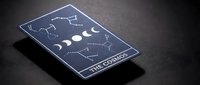 Mystical tarot card featuring moon phases and constellation patterns on dark cosmic background for spiritual divination and fortune telling practices.