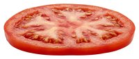 Ripe tomato slice isolated on white background, fresh produce for cooking, salads, and culinary design projects.