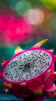 Fresh dragon fruit slice with vibrant pink skin and white flesh dotted with black seeds against blurred colorful background, macro food photography.