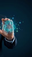 Businessman hand holding glowing recycling symbol with digital particles on dark blue background representing sustainable business practices.