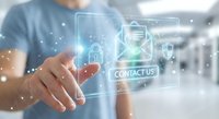 Professional man touching holographic contact us interface with digital icons in modern office environment for business communication and customer service.