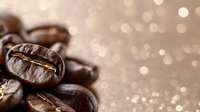 Roasted coffee beans macro shot with golden bokeh background, shallow depth of field creates dreamy atmosphere for cafe and coffee shop marketing.
