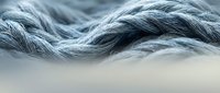 Flowing silver and gray waves of hair or fiber create an abstract, textured composition with soft lighting and depth, suitable for backgrounds, design projects, and creative concepts.
