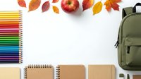 Back to school flat lay with colorful pencils, notebooks, green backpack and autumn leaves on white background for educational design projects.