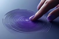 A woman's finger with purple nail polish touches a surface creating concentric ripple rings, symbolizing touch, technology, and digital interaction.