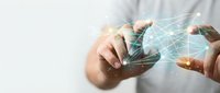 Business professional using smartphone with digital network connections and data visualization overlay for modern communication technology.
