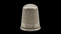 Vintage metal thimble with ornate band and dimpled dome, isolated on transparent background. Ready for clipart, print-on-demand, sublimation, t-shirt design, and craft projects.