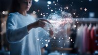 Young woman interacting with glowing digital hologram particles in retail environment, showcasing futuristic shopping technology.