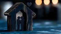 Silhouette of loving couple inside rustic wooden house shape with heart on top against soft bokeh lights, romantic mood on blue textured background.