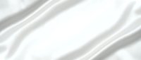 Smooth white silk fabric with soft diagonal folds and luxurious texture, ideal for backgrounds, textile design, and elegant product presentations.