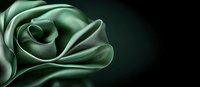 Elegant green rose petals in macro view against dark background create dramatic floral composition with soft curves and luxurious satin texture.